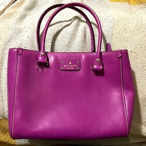 Fushia/Magenta Kate Spade bag. Inside has gold polka dots.